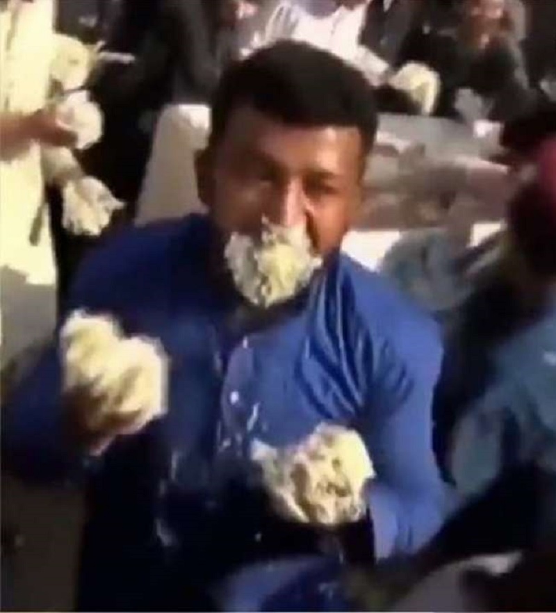 fighting for cake in Pakistan