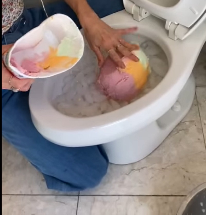 Woman made ice cream and cool drink in toilet bowl