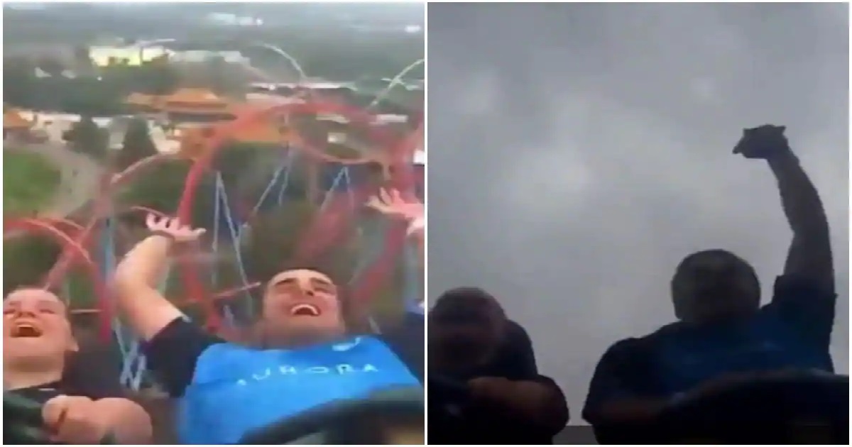 man catch mobile while riding roller coaster