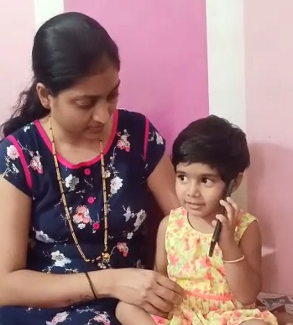 3 year old girl waiting for her father in Karnataka