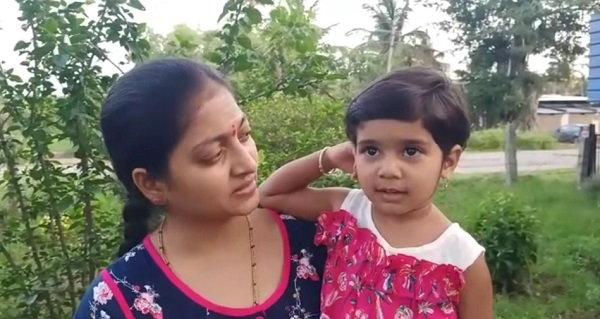 3 year old girl waiting for her father in Karnataka